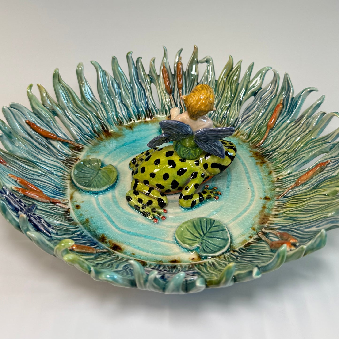 03 Fairy riding a fire bellied toad in a pond - White Stoneware